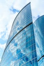 Fragment of contemporary architecture, walls made of glass and concrete. Glass curtain wall of modern office building