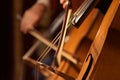 Fragment contrabass closeup.blurred hand of a man, playing the contrabass