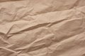 Fragment of crumpled blank sheet of brown wrapping kraft paper