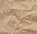 Fragment of crumpled blank sheet of brown wrapping kraft paper