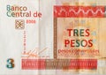 Fragment of crumpled cuban banknote of orange three pesos convertibles 2016
