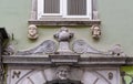 Fragment of decorative adornment of the facade of an old house (19th century