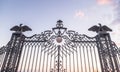 Fragment of the decoratively decorated gate with lanterns and decorative eagles - the upper entrance to the Bahai Garden on the st