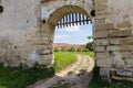 Fragment of defense stone wall with entrance in mediaeval castle Royalty Free Stock Photo