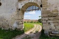 Fragment of defense stone wall with entrance in mediaeval castle