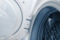Fragment of a door and drum of washing machine Royalty Free Stock Photo