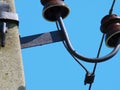 Fragment of an electric transmission support with insulators and wires. Royalty Free Stock Photo