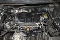 A fragment of the engine compartment of a car with a three-cylinder diesel engine Royalty Free Stock Photo