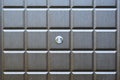 Fragment of an entrance door with a door peephole. Concept: daily security, uninvited guests Royalty Free Stock Photo