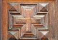 Carved cross on the door. Royalty Free Stock Photo