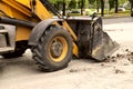 Fragment of an excavator. Repair work on the streets of the city.