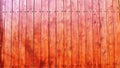 Fragment of the exterior made of reddish stained fence boards Royalty Free Stock Photo