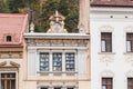 Fragment of the facade of the building in Gheorghe Bartitiu street in the Old city of Brasov in Romania