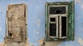 wall of an abandoned broken house with two windows Royalty Free Stock Photo