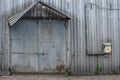 A fragment of the facade of an old metal industrial building Royalty Free Stock Photo