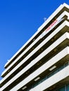 Fragment of the facade of a white office building on a background of blue sky Royalty Free Stock Photo