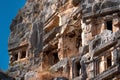 Fragment of famous complex of rock tombs in the ruins of Myra of Lycia with reliefs on the cliff