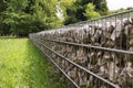 A fragment of a fence made of gabions. Separation of the street from the park area