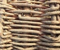 Fragment of a fence made of wicker vine, full screen image