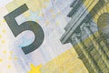 fragment of five Euro bill. 5 euro banknote close-up. Royalty Free Stock Photo
