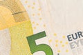 fragment of five Euro bill. 5 euro banknote close-up. Royalty Free Stock Photo