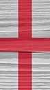 Fragment of the flag of England on dry wooden surface, cracked with age. It seems to flutter in the wind. Mobile phone wallpaper Royalty Free Stock Photo