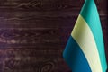 Fragment of the flag of the Gabonese Republic in the foreground space for text blurred background