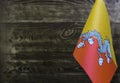 Fragment of the flag of the Kingdom of Bhutan in the foreground blurred background Kopi space Royalty Free Stock Photo