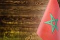 Fragment of the flag of Morocco in the foreground place for text blurred background