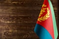 Fragment of the flag state of Eritrea in the foreground space for text blurred background Royalty Free Stock Photo