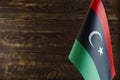Fragment of the flag of the state of Libya in the foreground space for text blurred background Royalty Free Stock Photo