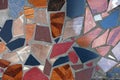 Fragment of a floor from pieces of a multi-colored tile background.