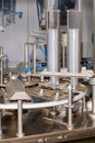 Fragment of a food processing line for filling and packaging liquid products Royalty Free Stock Photo