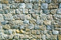 Fragment of a fortified wall made of stones and cemented with cement mortar Royalty Free Stock Photo