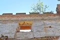 A fragment of a fortress brick wall with a window opening. Shaaken Castle, XIII century. Kaliningrad region Royalty Free Stock Photo