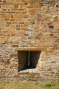 Fragment of the fortress wall with embrasure Royalty Free Stock Photo