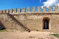 Fragment of the fortress wall with stairs and embrasure Royalty Free Stock Photo