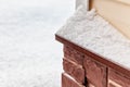 Fragment of the foundation of a country house in the snow. Royalty Free Stock Photo