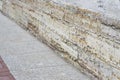 A fragment of the Foundation of an old building with a number of modern paving slabs. Background Royalty Free Stock Photo