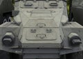 A fragment of the frontal armor of an armored personnel carrier with grille elements