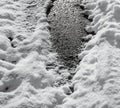 Fragment of a frozen water puddle