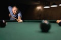 A fragment of a game of billiards in progress. American pool billiards. Billiard game. Billiard sport concept. Young