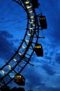 Fragment of giant ferris wheel under dramatic sky