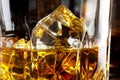 Fragment of a glass of whiskey with ice