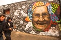 Fragment of graffiti on Berlin Wall at East Side Gallery - it's a 1.3 km long part of original Wall which collapsed in 1989 Royalty Free Stock Photo