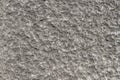 Gray concrete backgroundl with small white stones. Texture or ba Royalty Free Stock Photo