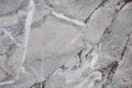 Fragment of gray marble with black and white veins, polished surface of natural stone close-up Royalty Free Stock Photo