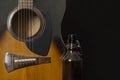 Fragment of a guitar and an empty bottle of beer Royalty Free Stock Photo