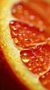 Fragment of halved orange with juice drops. Vertical picture of healthy fruit, mandarin oranges, vitamin C, refreshing Royalty Free Stock Photo