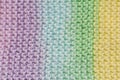 Fragment of handmade seamless knitted patterns in mixed pastel colors Royalty Free Stock Photo